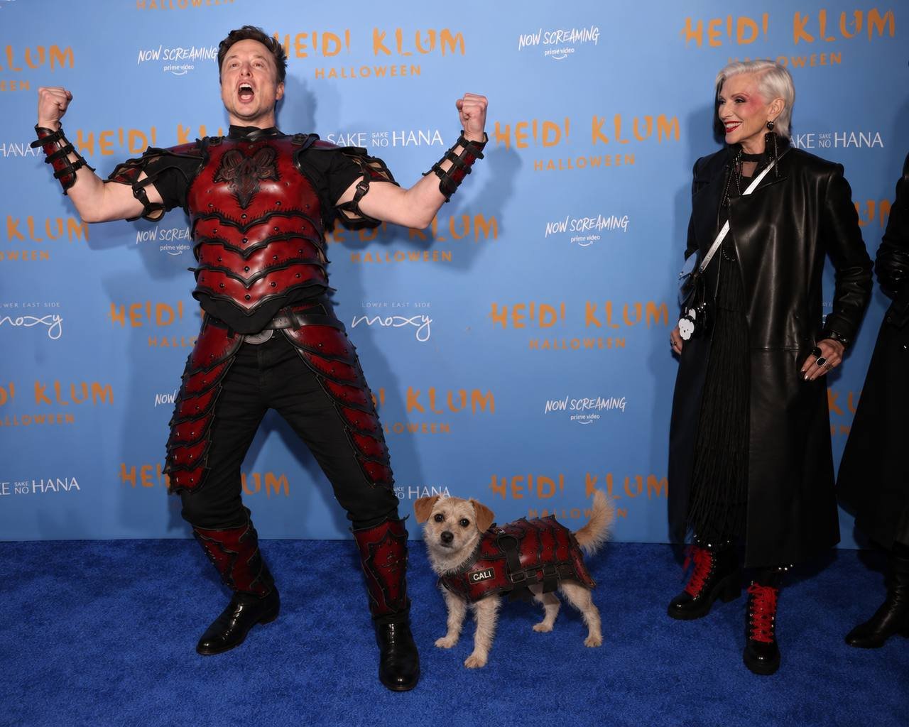 Cali in costume on a blue carpet at Halloween